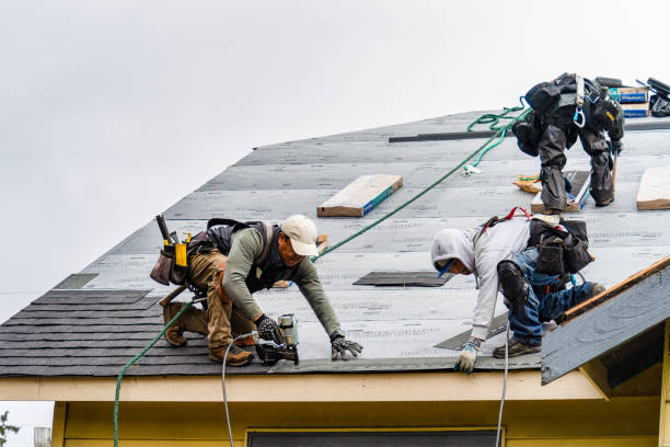 Professional Storm Damage Roof Repair technician working in Harwinton, CT